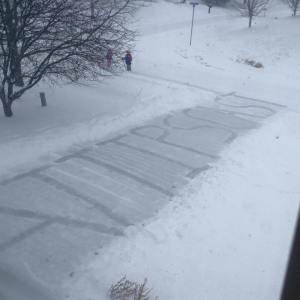 Driveway shoveled to spell A.T.TIPSCAST